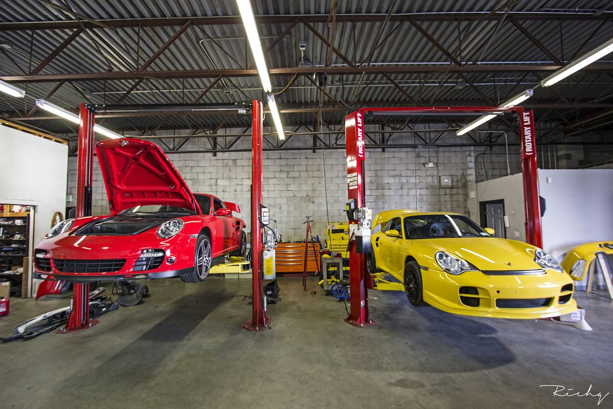 Sports cars on hydraulic lifts in our workshop